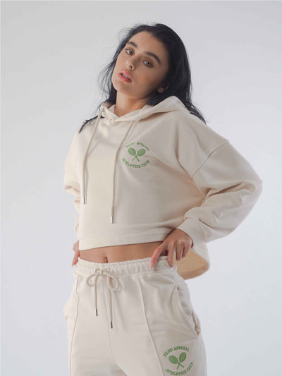 Model has dark hair and is wearing a matching hoodie and joggers in the colour eggnog.