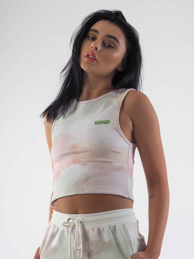 A cropped vest in a watercolour tie dye print. The WKND Apparel logo is embroidered to the chest.